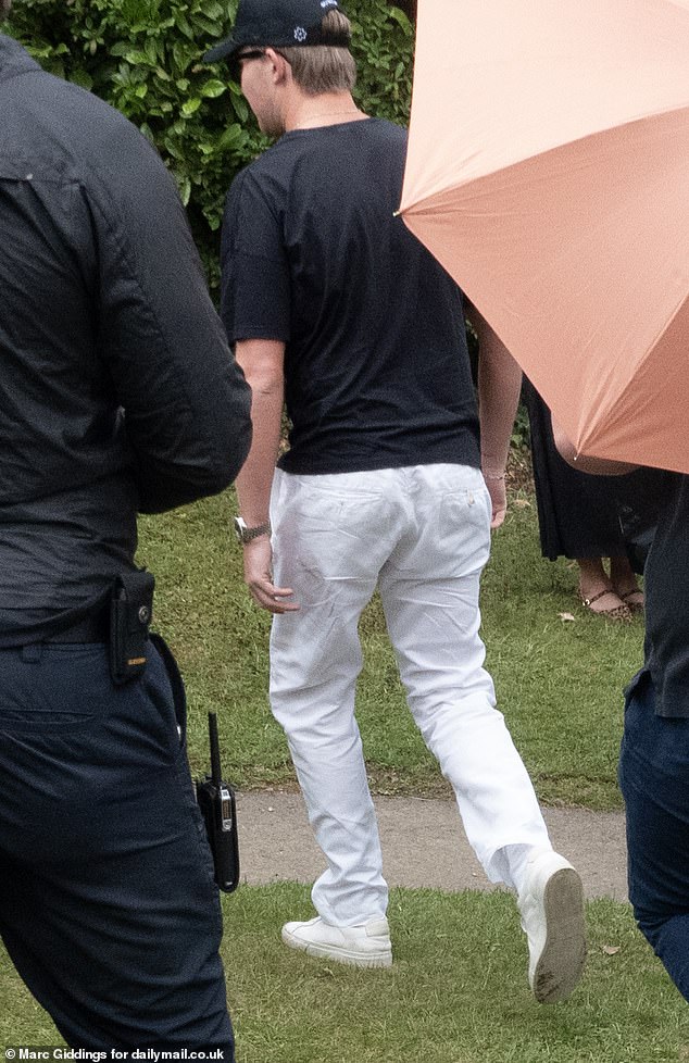 Eve, Apple founder Steve Jobs' youngest daughter, was thought to have stepped out wearing chic white trousers and a long black trench coat, while her groom (thought to be pictured) appeared to match his bride in a similar monochrome outfit