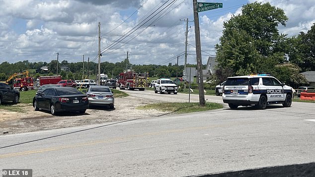 A state trooper has been seriously wounded in a shootout at a major airport before the gunman fled into a church (street outside pictured) during Sunday service