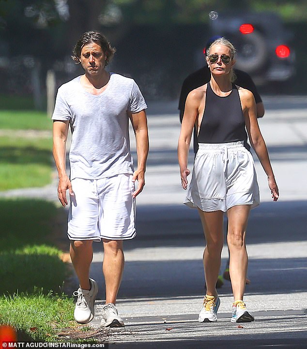 Bra-free Gwyneth Paltrow and her husband Brad Falchuk were seen out for a walk in the Hamptons on Sunday