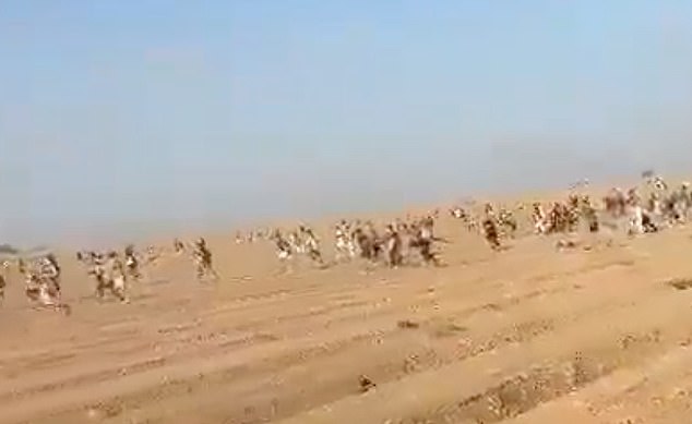 People flee from the site of the Nova music festival during the Hamas-led attack on October 7