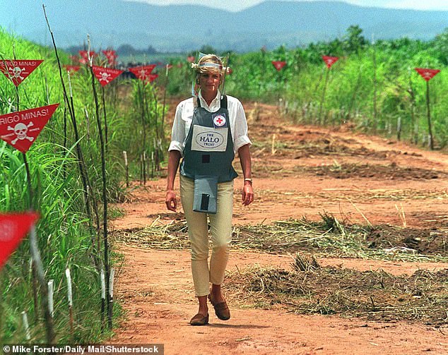 In a flak jacket and face shield, Princess Diana walks along a cleared path on a landmine site in Angola for the Halo Trust in 1997, raising global awareness about the dangers of landmines and contributing to the signing of the Ottawa Treaty banning their use