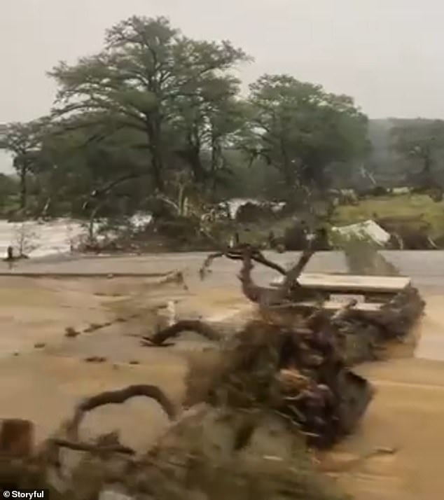 The footage shows what the girls saw as they drove through moving water - past downed trees, destroyed homes and piled up cars