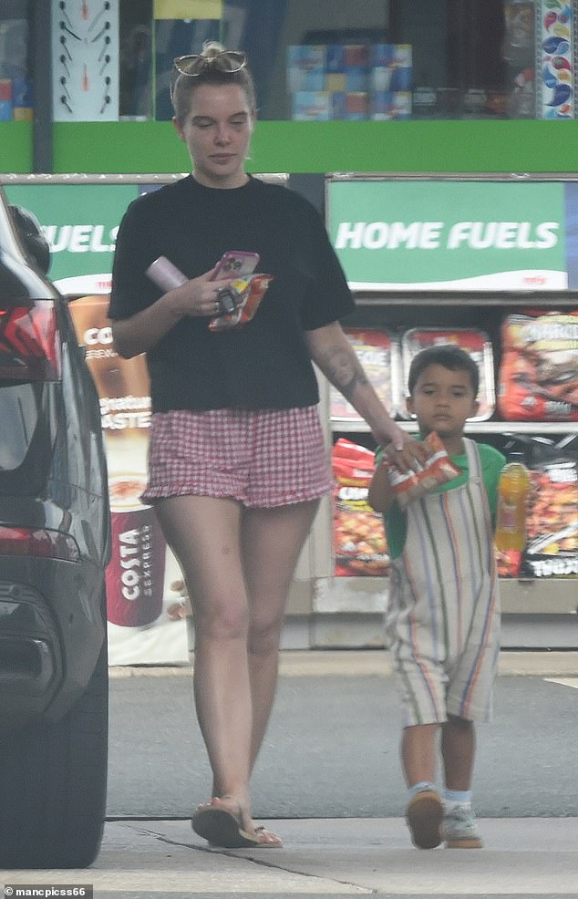 Helen Flanagan displayed her painful-looking black eyes as she filled up her £66,000 Audi with petrol on Friday