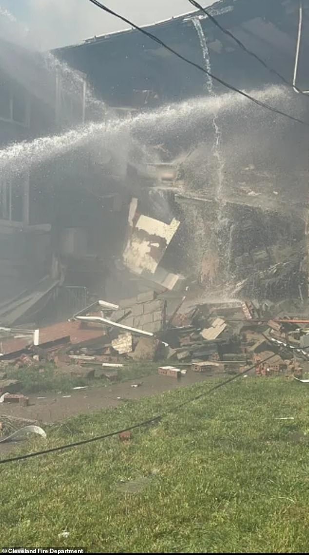 The huge fire caused approximately $3.5million of damage. Pictured: firefighters trying to put out the flames