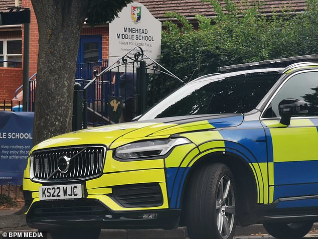 A police car is seen outside Minehead Middle School in Somerset on Thursday evening