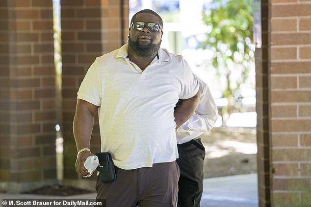 Isiah, pictured behind his father Victor Barnes outside court on Wednesday, cried on the witness stand as he told how he saved his girlfriend's life as her parents allegedly tried to strangle her in an 'honor killing'