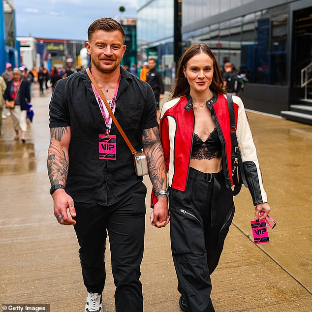 Holly Ramsay commanded attention in a black lace bralette as she arrived at Silverstone for the British Grand Prix with partner Adam Peaty on Sunday