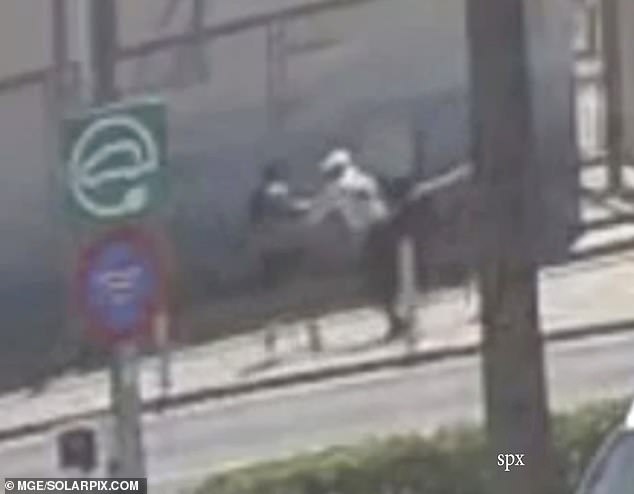 Footage grabs show an elderly British holidaymaker was mugged and dragged to the ground while he was on a walk through a resort in Majorca with his wife