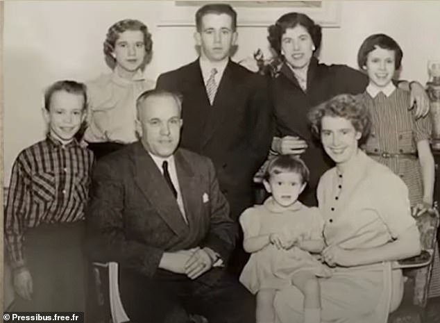 The little girl with a pudding bowl haircut sitting on her mother's knee is Brigitte Trogneux, and far left is her brother Jean-Michel