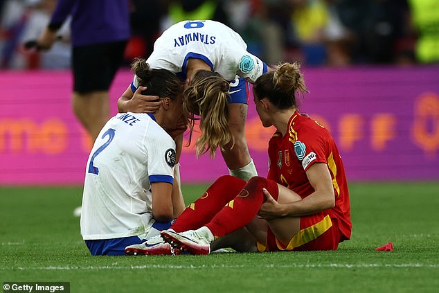 Lucy (left) and Ona (right) sat down on the pitch during the wild final whistle celebrations on Sunday