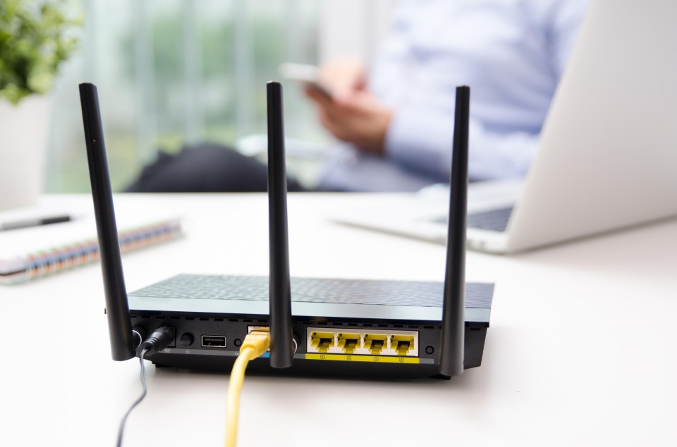 Wireless router connected to network cable.