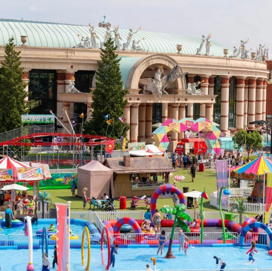 Summer fair at the Trafford Centre with rides and water play.