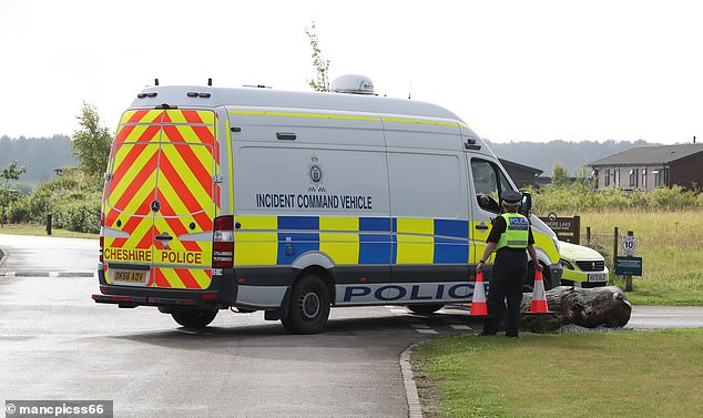 A police incident command vehicle is seen arriving at 9am alongside a fire and rescue vehicle and an underwater search and marine unit at Delamere Lake in Cheshire
