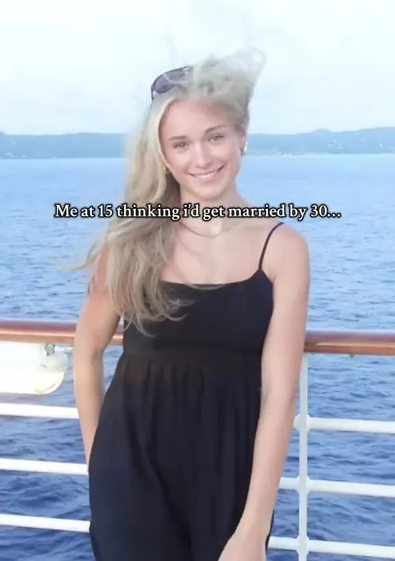 Photo of a young woman on a ship, reflecting on her younger self's expectations of marriage.