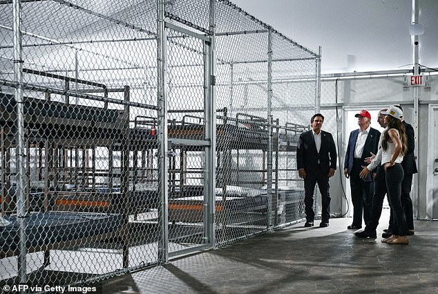 New Trump administration guidance will force millions of migrants who entered the United States illegally to be detained throughout their deportation proceedings. The president is pictured here touring the controversial 'Alligator Alcatraz' facility with Homeland Security Secretary Kristi Noem and Florida Gov. Ron DeSantis on July 1