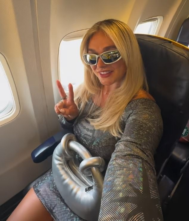 Hettie, 26, from Essex went to Ibiza with no hotel booked for a night out. She's pictured onboard the plane