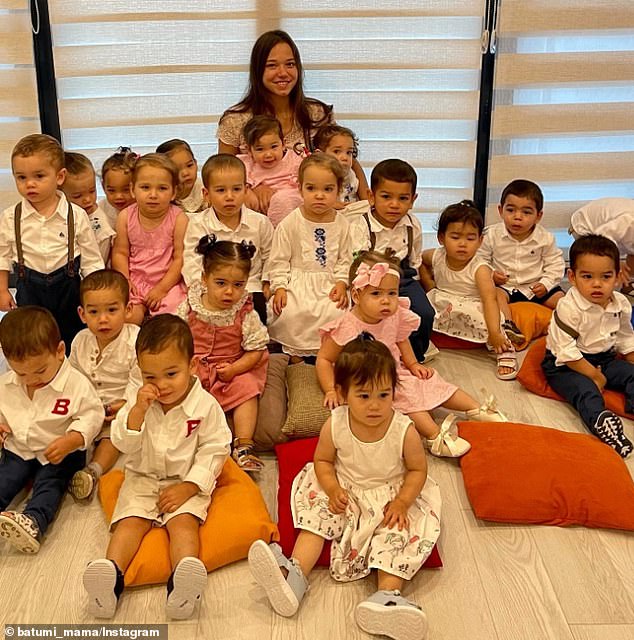 Nearly two years after she disappeared from social media, a Russian'mumfluencer' who welcomed 21 children via surrogacy with her criminal millionaire husband has resurfaced online. She is pictured here with her brood in a post shared on her Instagram, where Kristina has 248,000 followers