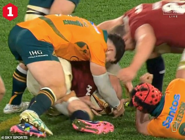 Australia's Carlo Tizzano (left) pounces to compete over the ball at a last-gasp breakdown