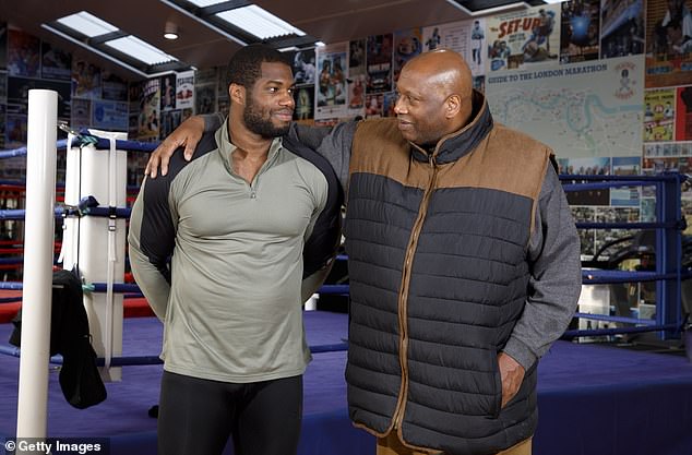 Dubois endured a tough build-up to his fight against Oleksandr Usyk due to circumstances surrounding his dad Stanley (right)