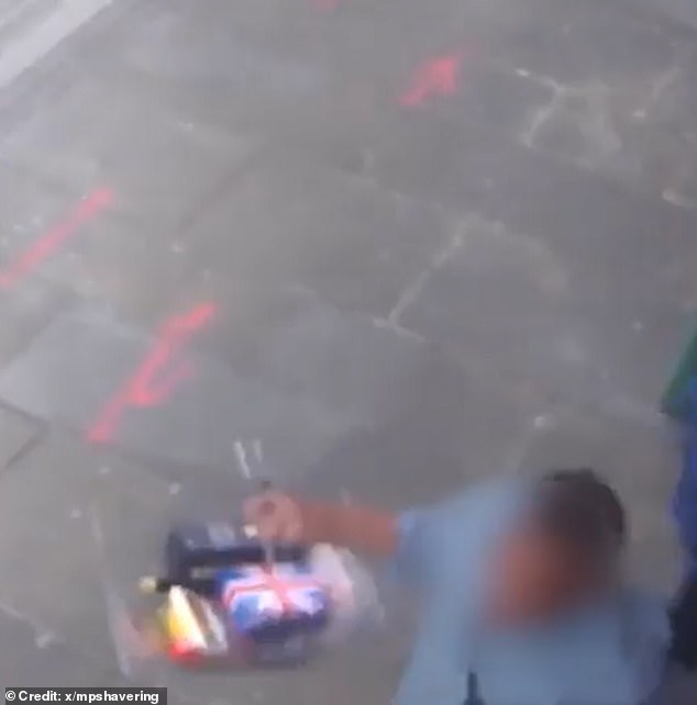 The footage shows the man leaving the Marks & Spencer store with a basket full of seemingly stolen goods