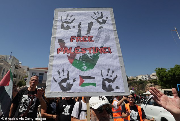 Activists from the sizeable protest, some garbed in keffiyehs, carried posters and placards accusing Israel of committing genocide and 'deliberately starving Palestinians'