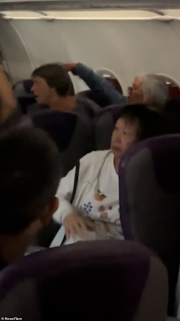 An elderly woman shouted and swore at a family in English after their toddler allegedly kicked her seat on a plane