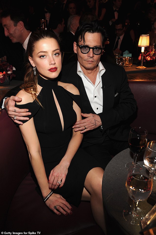 Johnny Depp has been booked and busy since winning a defamation case against his ex-wife Amber Heard in 2022 - but critics have questioned the quality of his latest projects and whether he'll ever truly have a career 'comeback' (Pictured: The ex-couple pose together in New York in 2014)