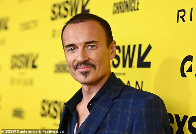 His blue checked jacket was hanging from his frail frame as he managed a smile for the photographers at the Zach Theatre in Austin, Texas