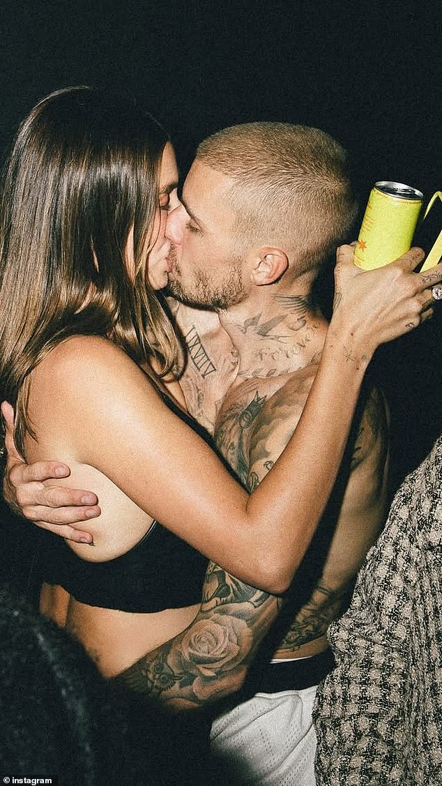 The couple shared several kisses for the camera, perhaps as a message to fans that the marriage problems he wrote about on the new album have been worked on
