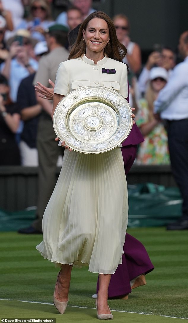 Kate Middleton, who has been patron of the All England Lawn and Tennis Club, since 2016, presents the women's winner and runner-up trophies