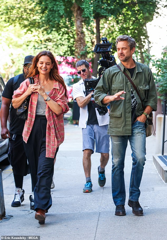 Katie Holmes excitedly reunited with her former Dawson's Creek leading man Joshua Jackson on the New York City set of their upcoming trilogy, Happy Hours