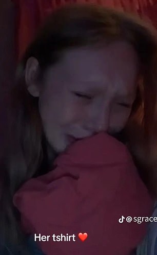 She's seen crying into her mother's clothes, in another video