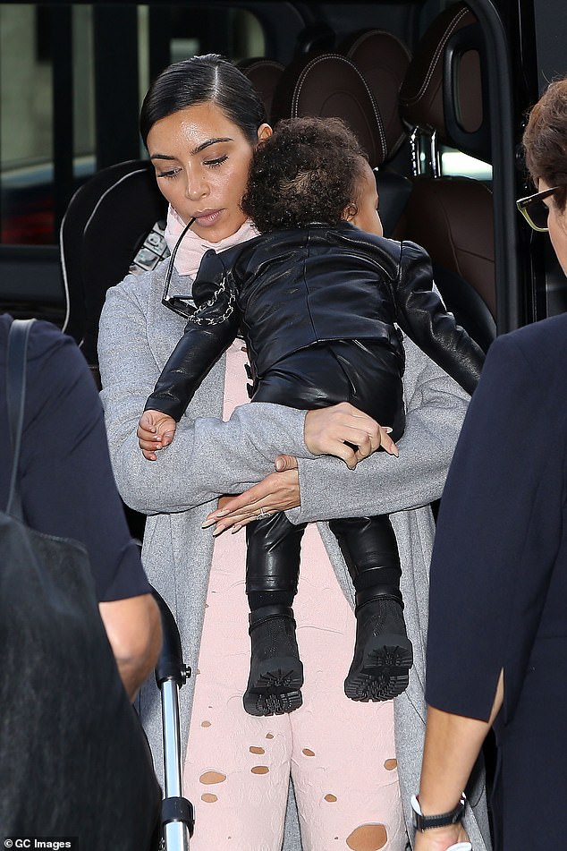 The SKIMs founder went viral in 2014 as she departed her hotel in the French capital without her then one-year-old daughter; pictured at the time