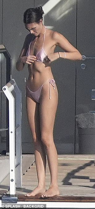 Vittoria sent temperatures soaring as she showed off her enviable figure in a light pink thong bikini