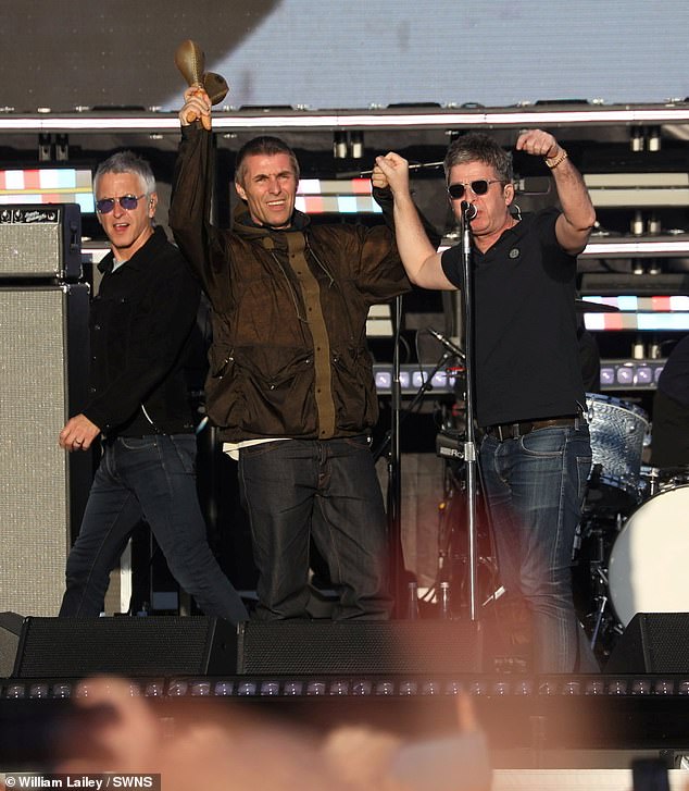 Oasis appeared hand in hand as they performed in front of a sold-out 80,000 strong crowd in their home city of Manchester after beginning their world tour in Cardiff last week