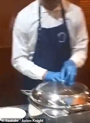 In the canteen, staff are seen serving breakfast to residents from food warmers containing beans, hash browns, cooked tomatoes and hard-boiled eggs