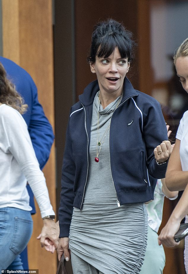 Lily Allen appeared in high spirits as she was seen for the first time since she admitted she 'can't remember' how many abortions she has had' on Thursday