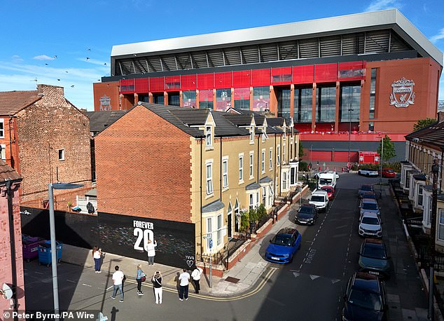 Supporters have begun to sign a mural in memory of the striker a short distance from Anfield