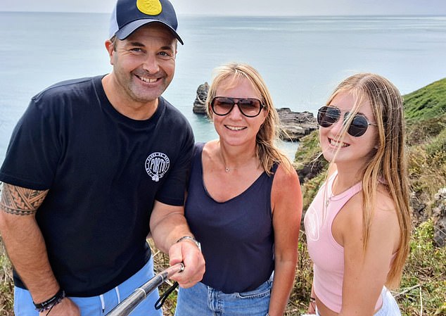 Mr Hyde stood next to his wife Nicola Hyde and their 16-year-old daughter Ellie