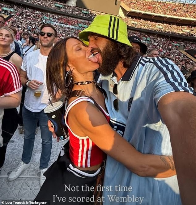 Andy Carroll and girlfriend Lou Teasdale proved their stronger than ever as they packed on the PDA while watching Oasis at Wembley on Saturday night