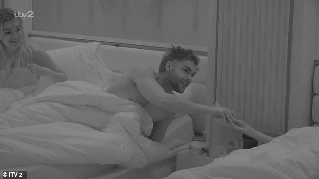 On Tuesday Harrison was seen whispering across the beds as he asked Harry whether he had a condom