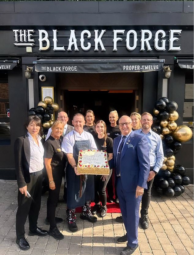 McGregor thanked the fire service for their 'incredible' and 'swift' response time as he shared a picture of the pub staff holding a cake outside the premises today