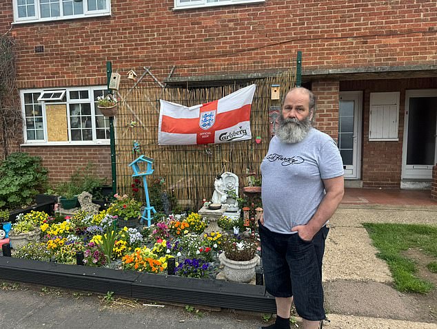 His garden now has an England flag hanging on a fence, a bird box and new plants