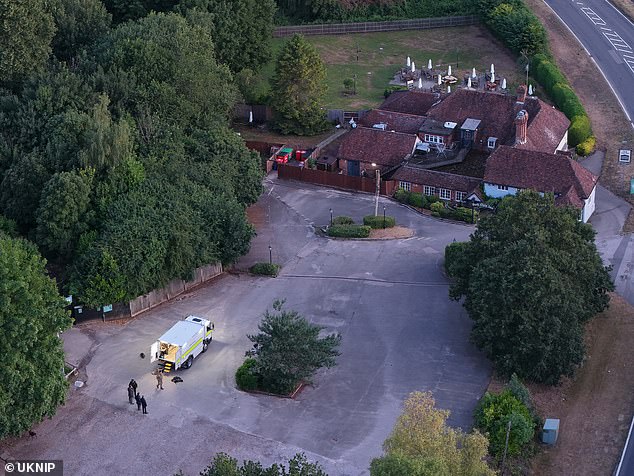 Armed police swarmed the area around a village pub in Kent last night - in an operation which saw a man being shot by cops