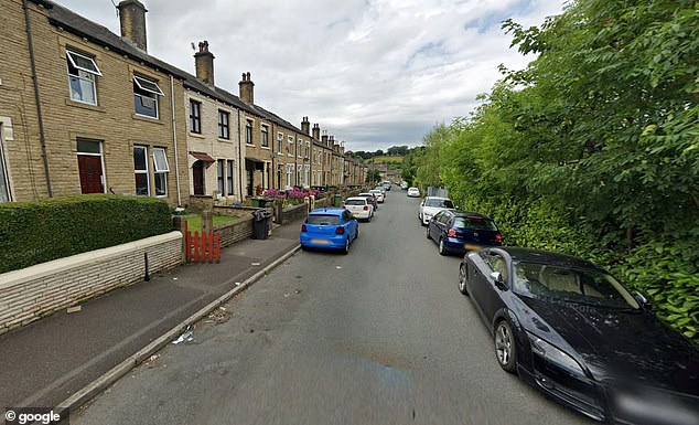 A manhunt has been launched after a masked shooter gunned down three people in an alleged drive-by attack Bulay Road in Huddersfield (pictured in a general view image)