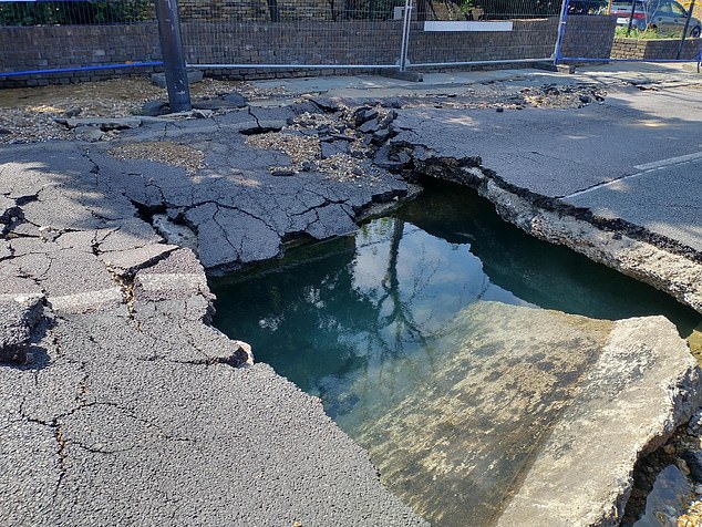 A massive sinkhole has opened up on Kings Avenue, near Clapham Common, with a burst pipe leading to major flooding and travel chaos