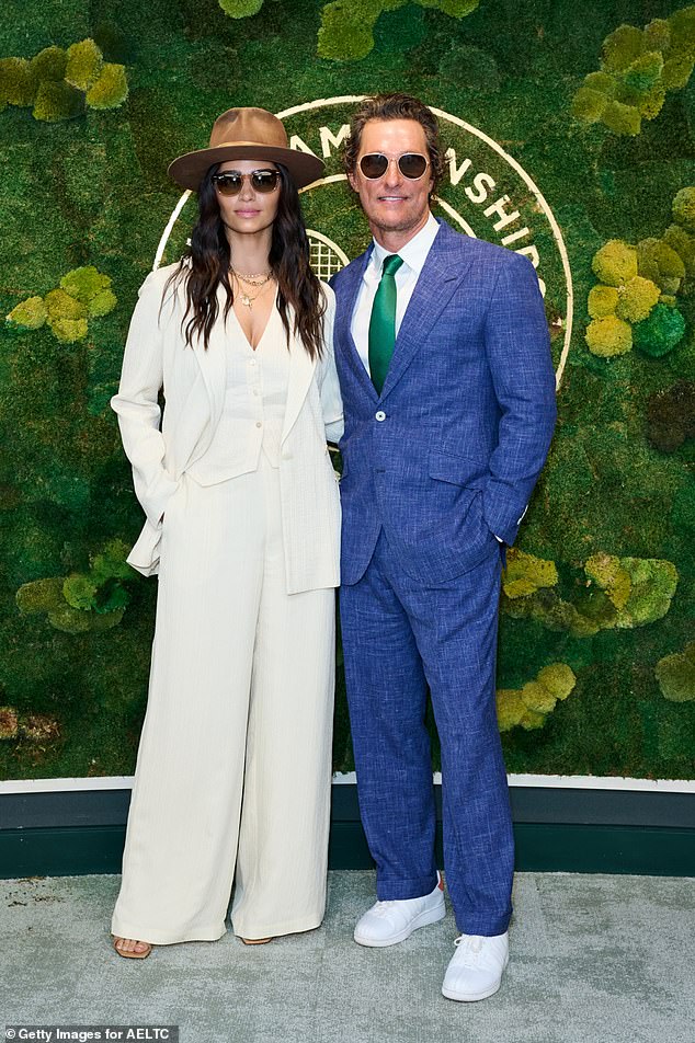 Matthew McConaughey, 52, cut a dapper figure in a blue suit as he joined his wife Camila Alves, 42, as they attended day 13 of the Wimbledon Tennis Championships on Saturday