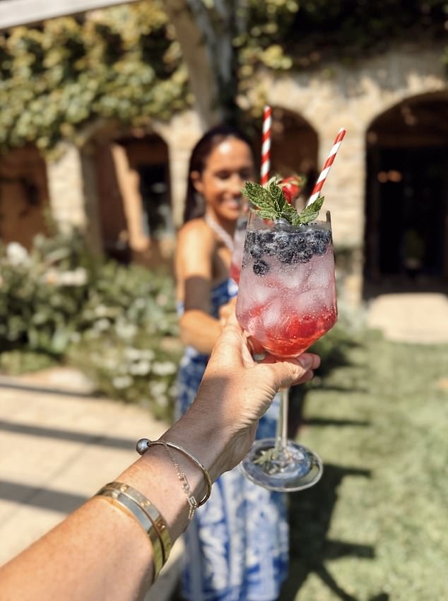 Meghan Markle has shared the recipe for a very patriotic Fourth of July cocktail - as she celebrated the US holiday in a chic blue and white two-piece