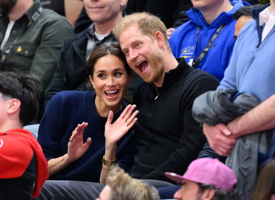 Meghan Markle and Prince Harry at a wheelchair basketball game.