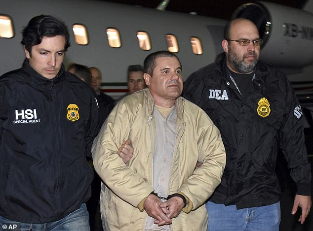 Joaquín 'El Chapo' Guzmán is escorted by U.S. federal agents upon arriving in New York on January 19, 2017 following his extradition from Mexico